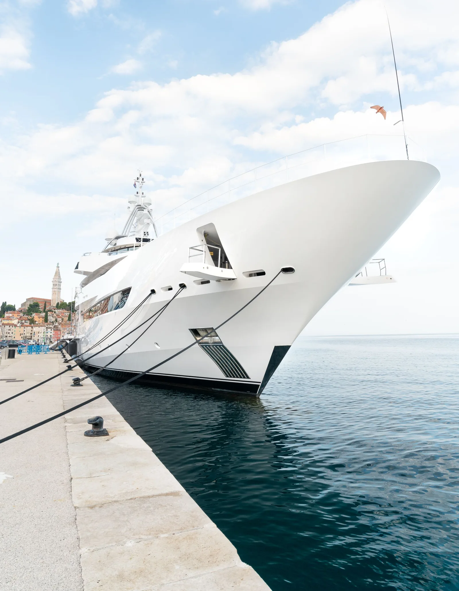 White superyacht bow against a clear sky